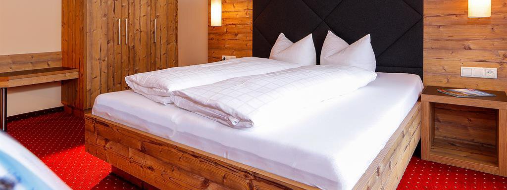 Schlafzimmer_TypTirol Schlafzimmer_TypTirol - Appartements Panorama - Längenfeld